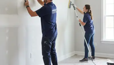 Painter repairing drywall cracks in San Diego, CA home for smooth wall restoration and texture matching