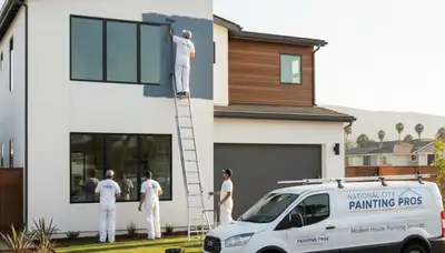 Professional house painters working on residential exterior in San Diego, CA